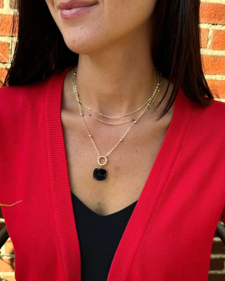 LINK customer wearing her necklace