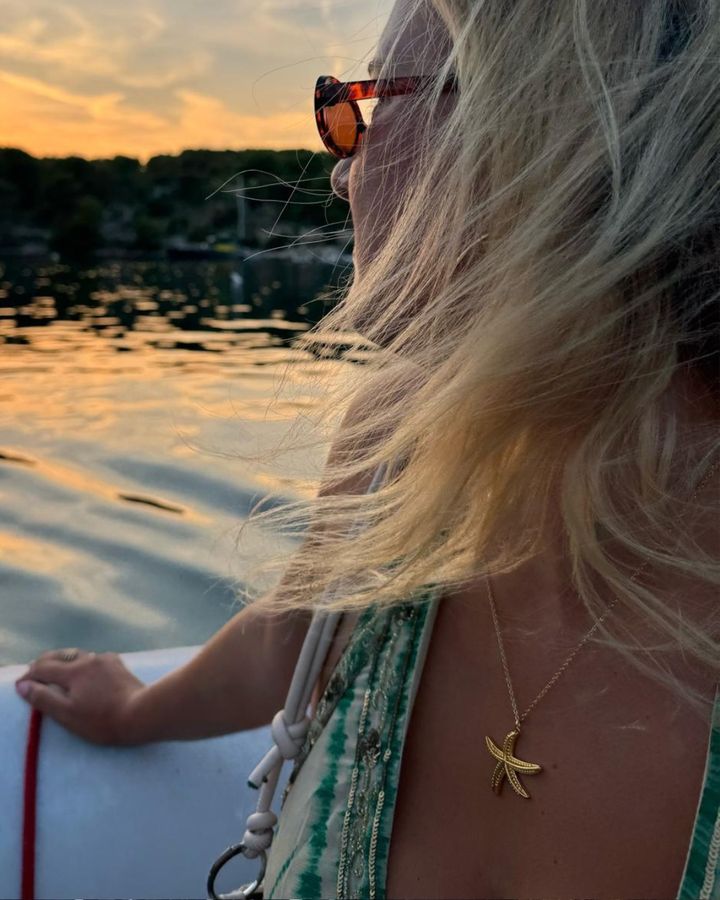 LINK customer wearing her necklace